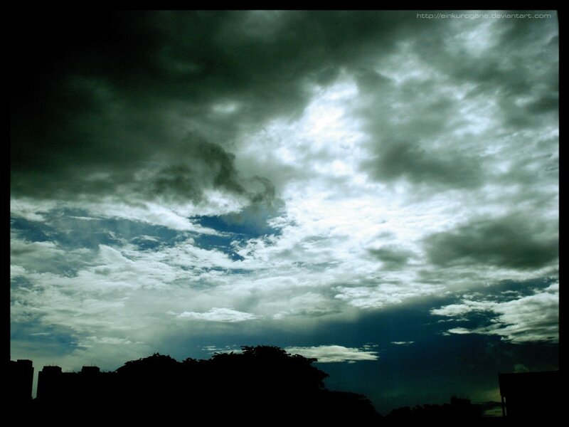 dark clouds over city skyline