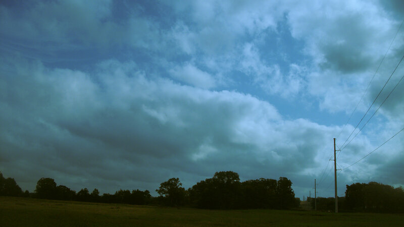Dark Clouds over Field — Blue