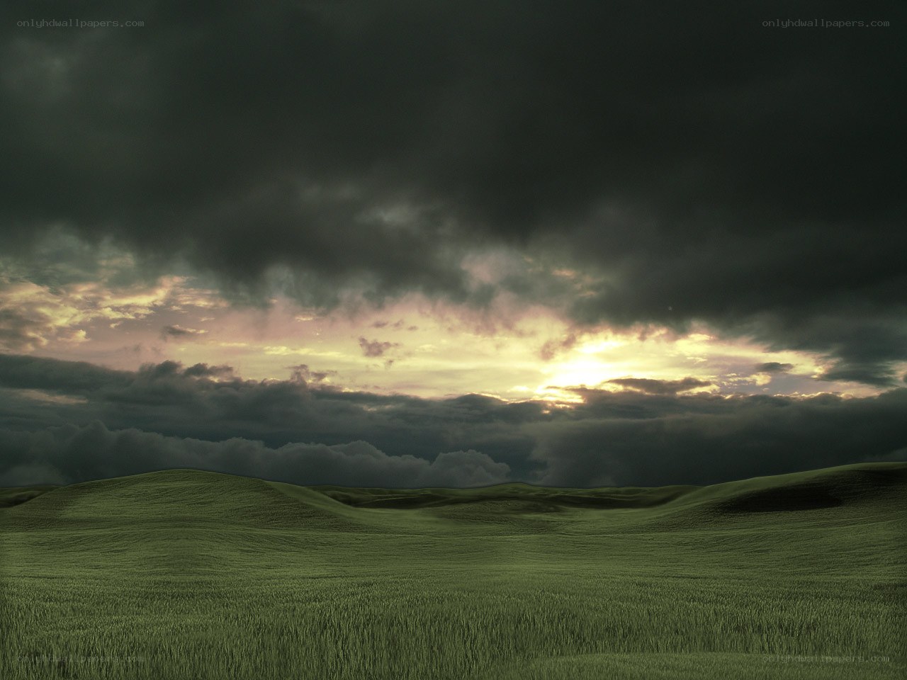 Dark clouds over green hills