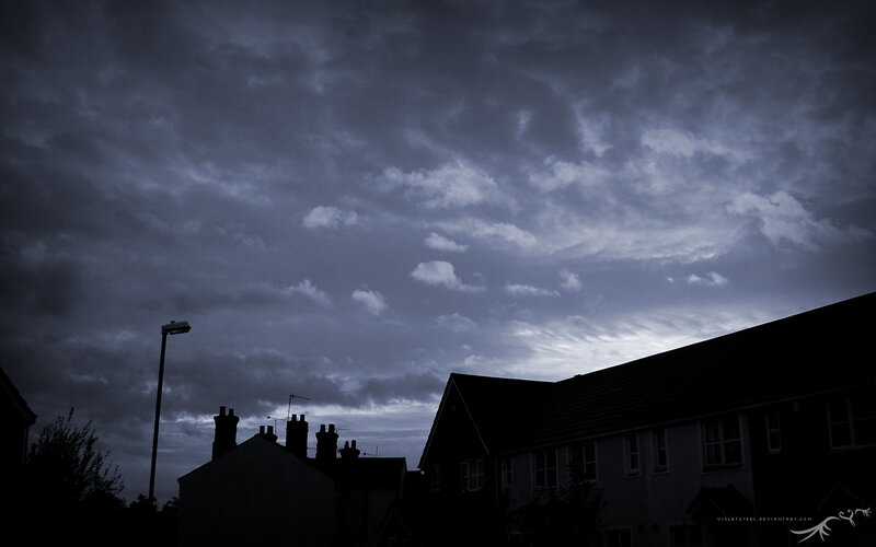 Dark clouds over houses