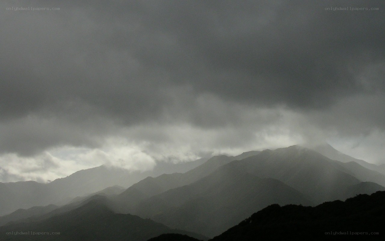 Dark clouds over mountain range