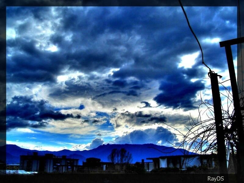 Dark Clouds over Mountains — Blue