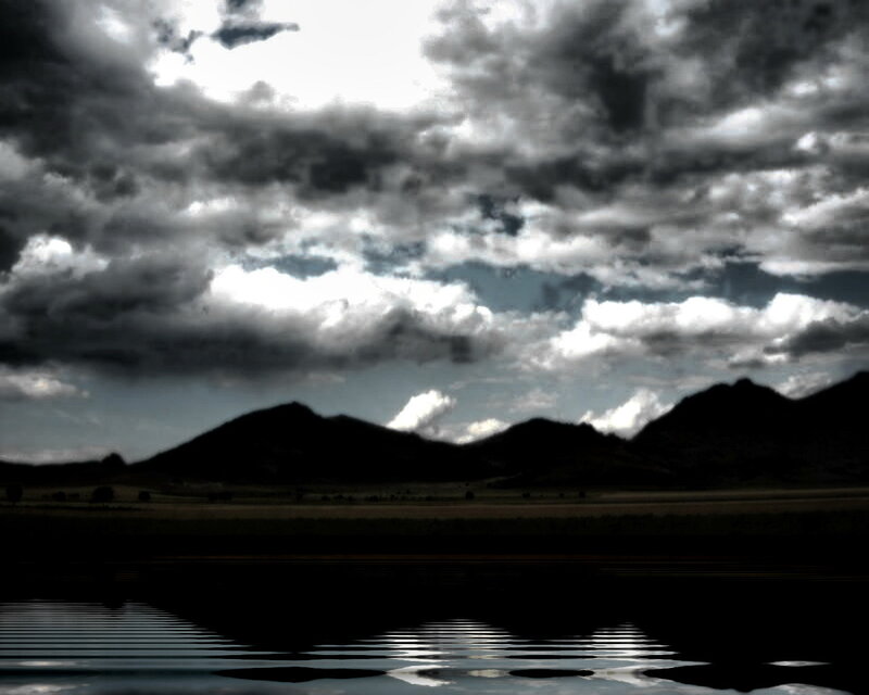 Dark clouds over mountains