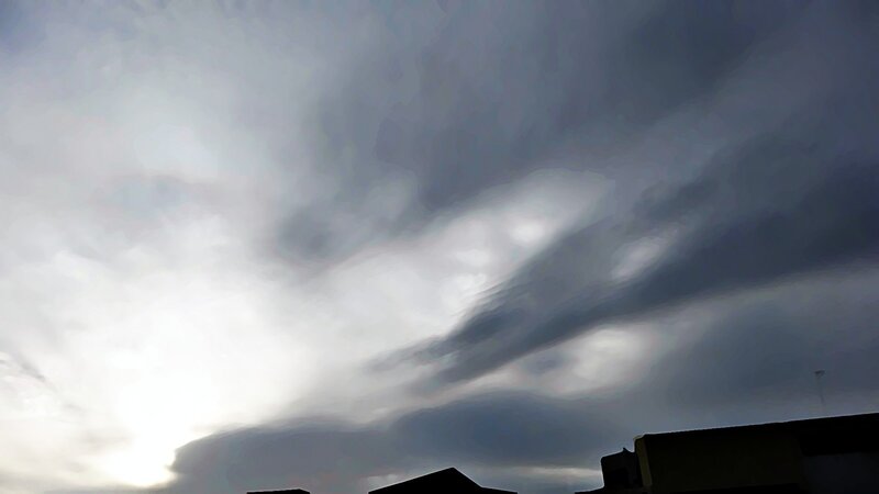 dark clouds over rooftops