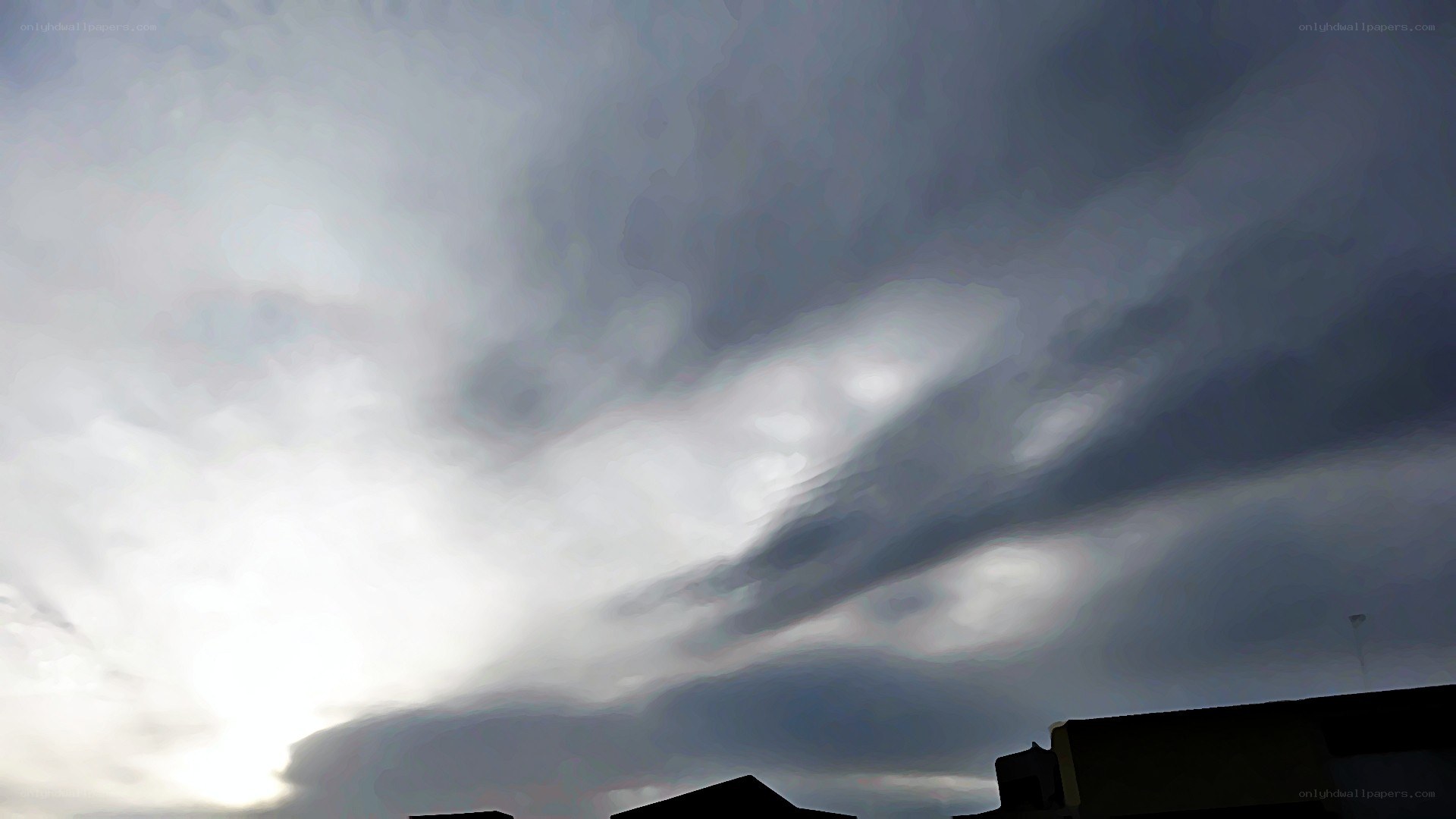 dark clouds over rooftops