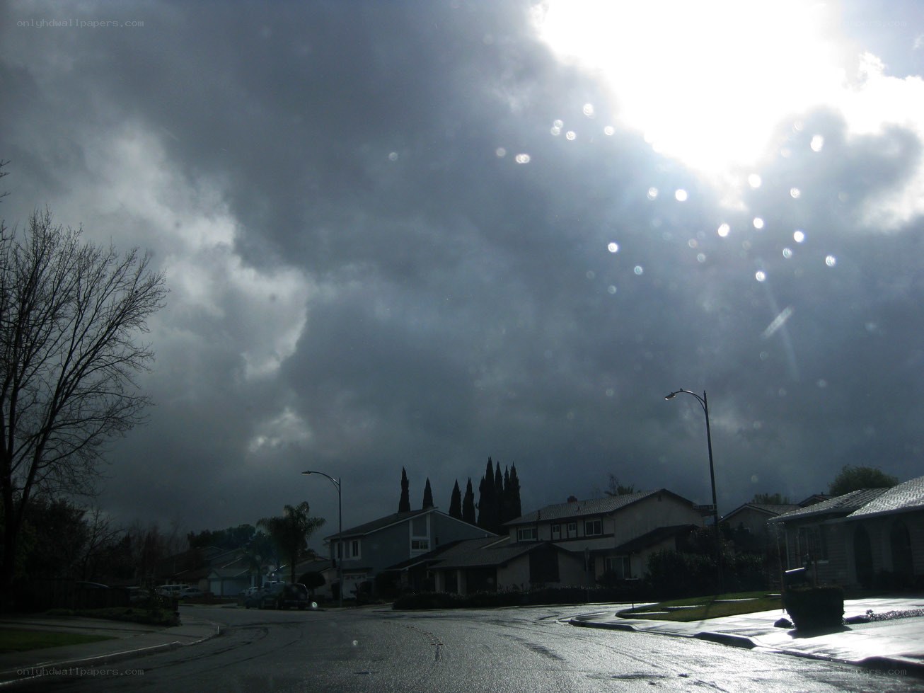 dark clouds over suburban street