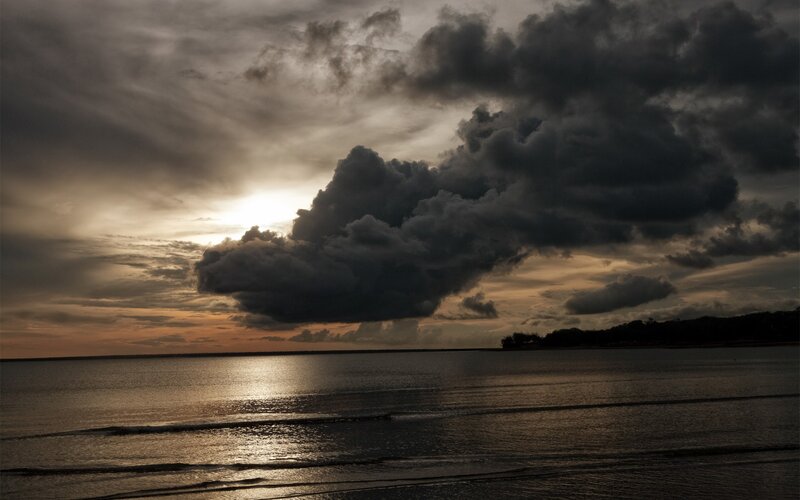 Dark Clouds over Water — Gray, Dramatic, Sunset, Photograph, Sun
