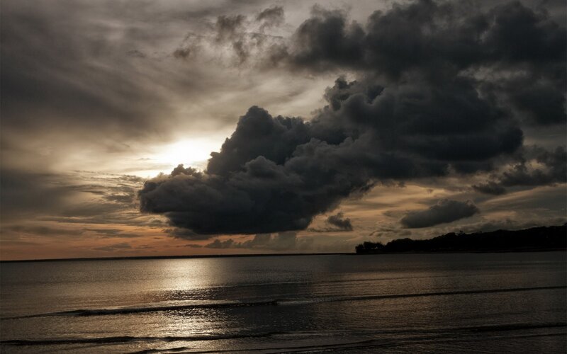 Dark Clouds over Water — Gray, Dramatic, Sunset