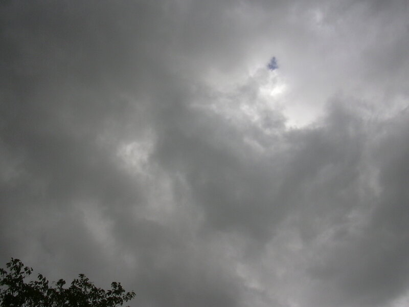dark clouds with sun peeking