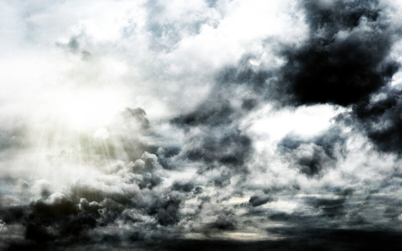 dark clouds with sunlight