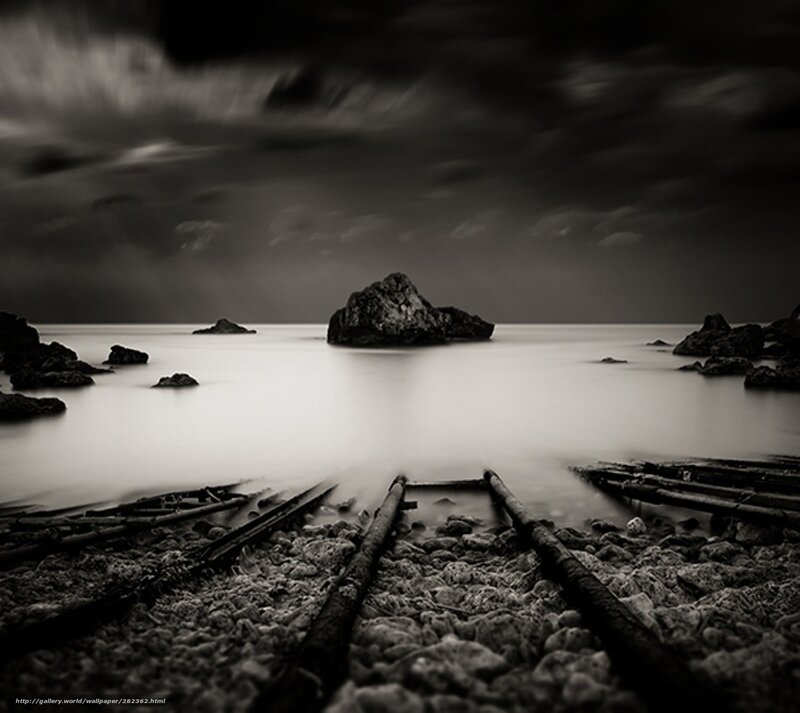 Dark coastal rocks at dusk