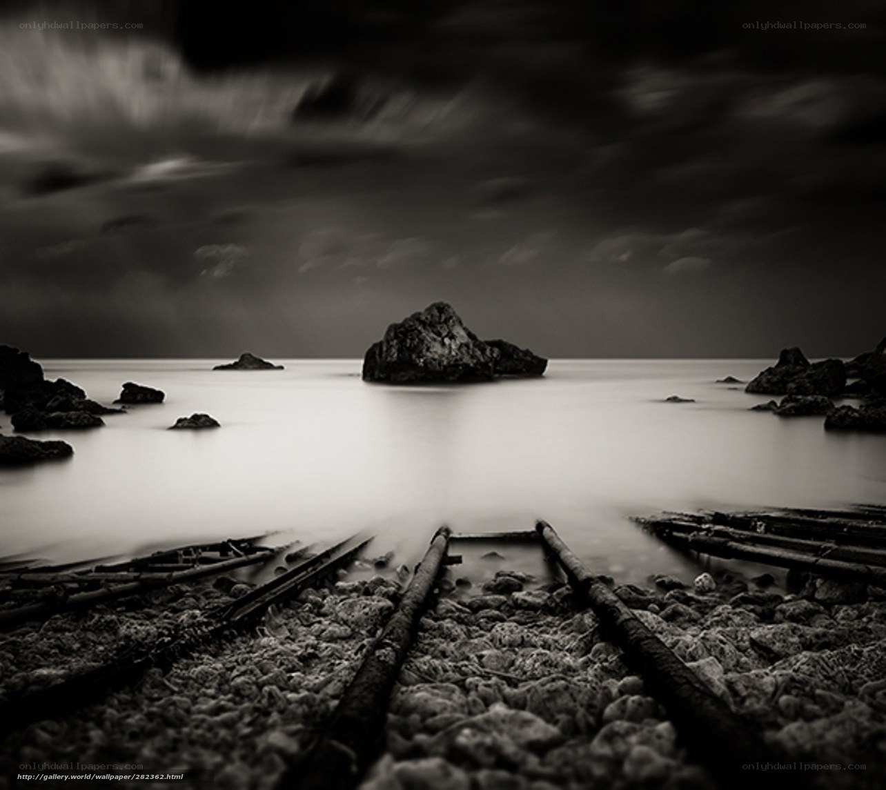 Dark coastal rocks at dusk