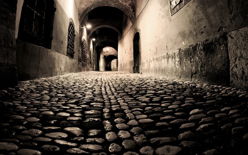 dark cobblestone alleyway