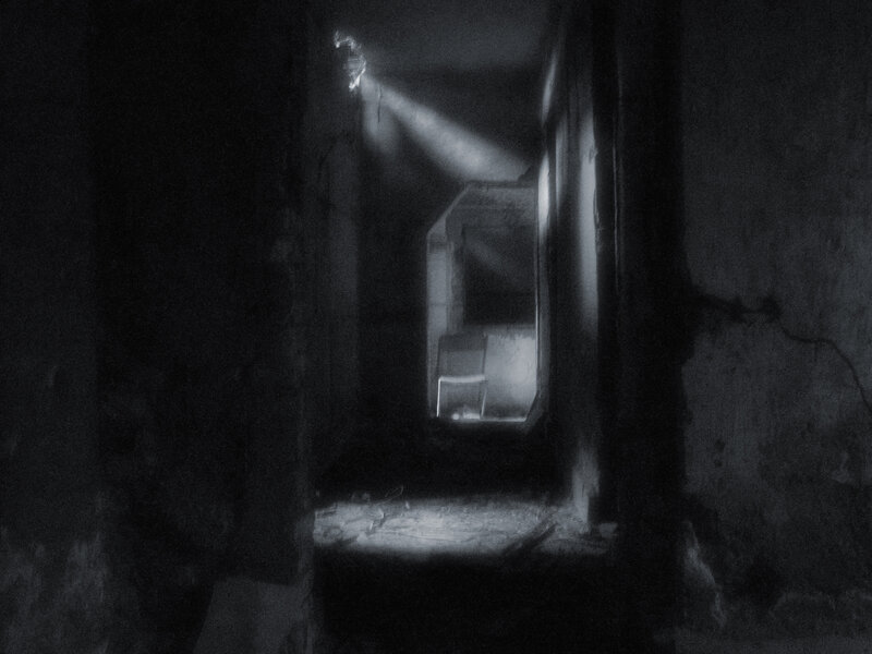 dark corridor with chair