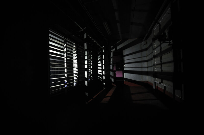Dark corridor with light stripes