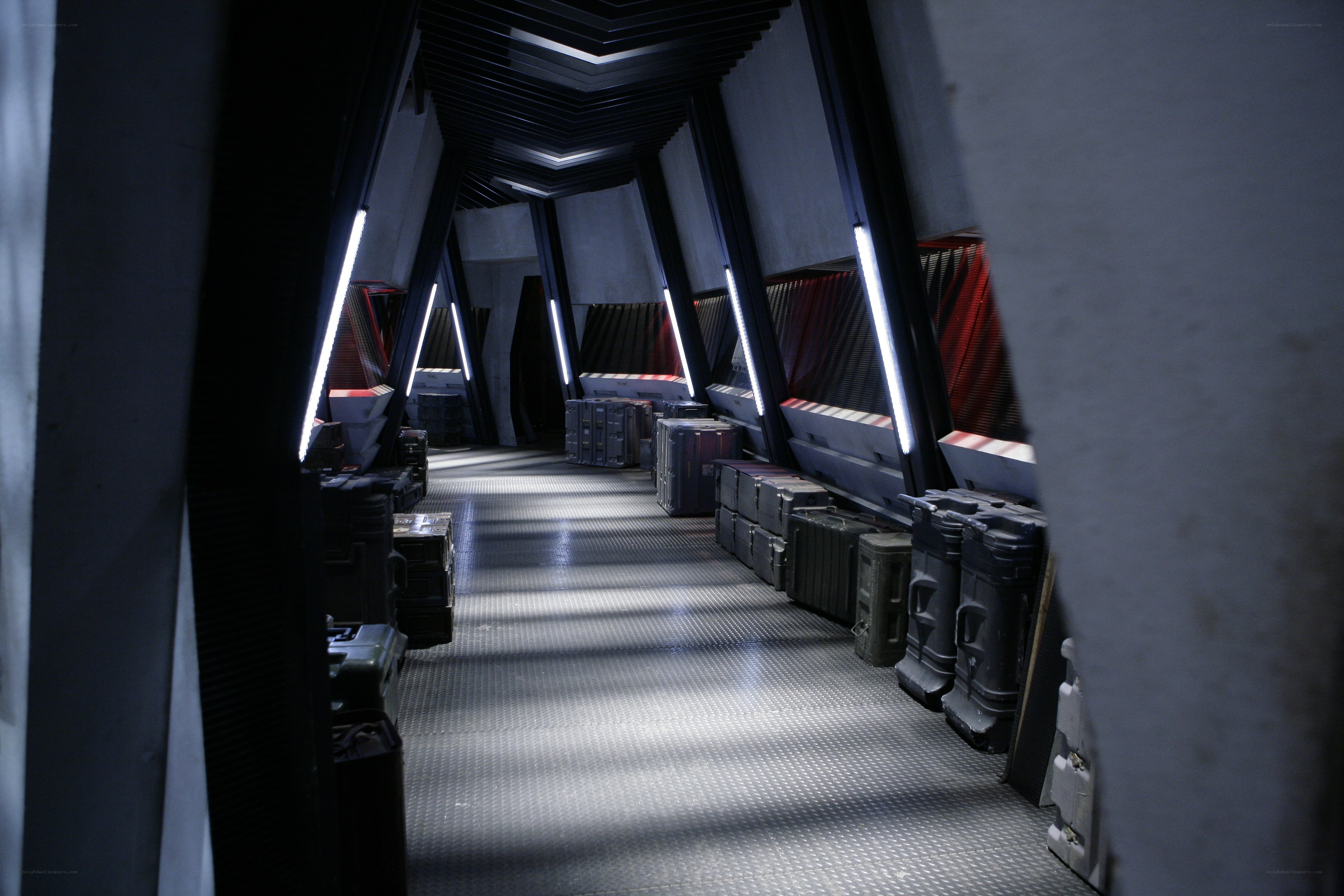 dark corridor with storage crates