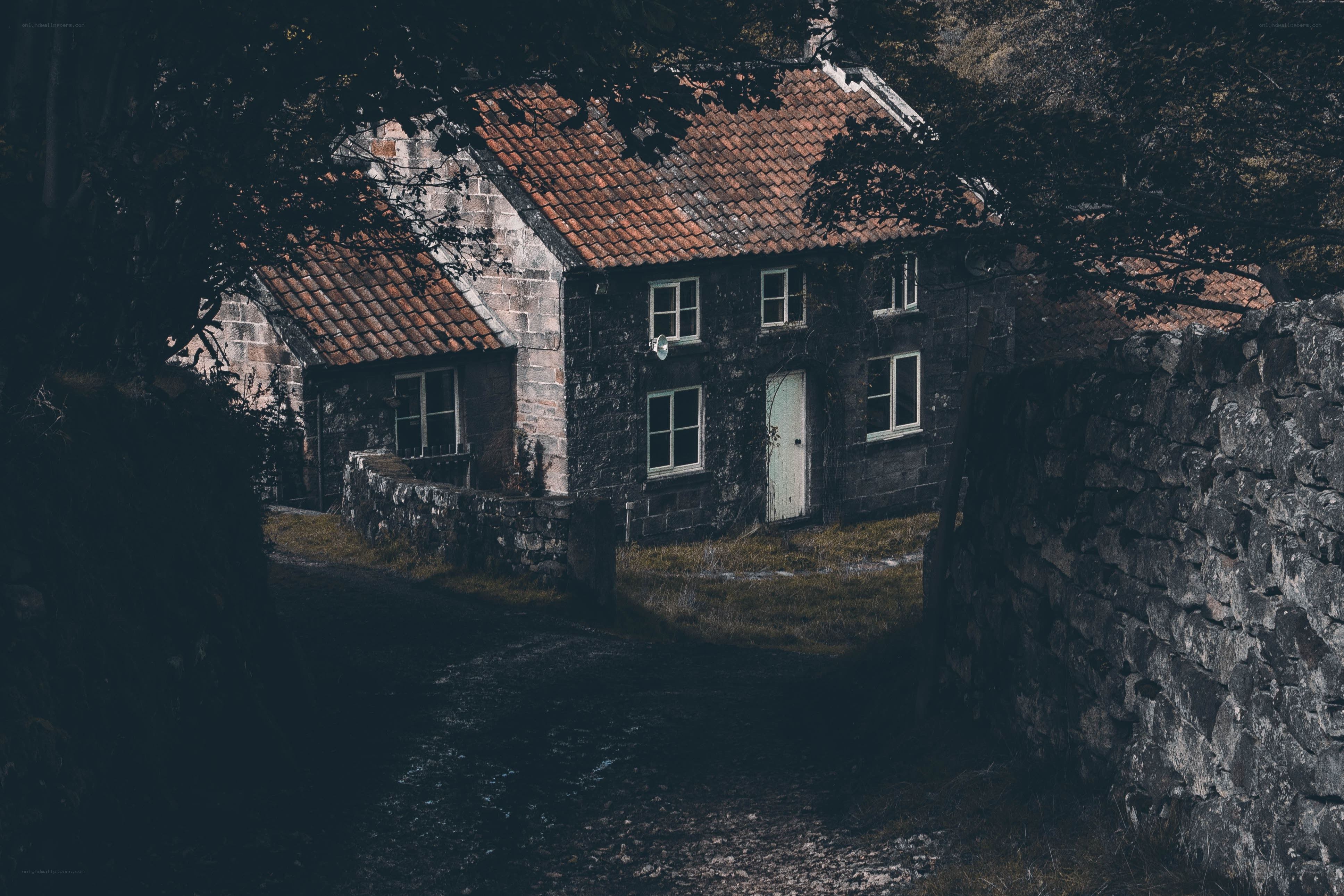 Dark cottage in a wooded area