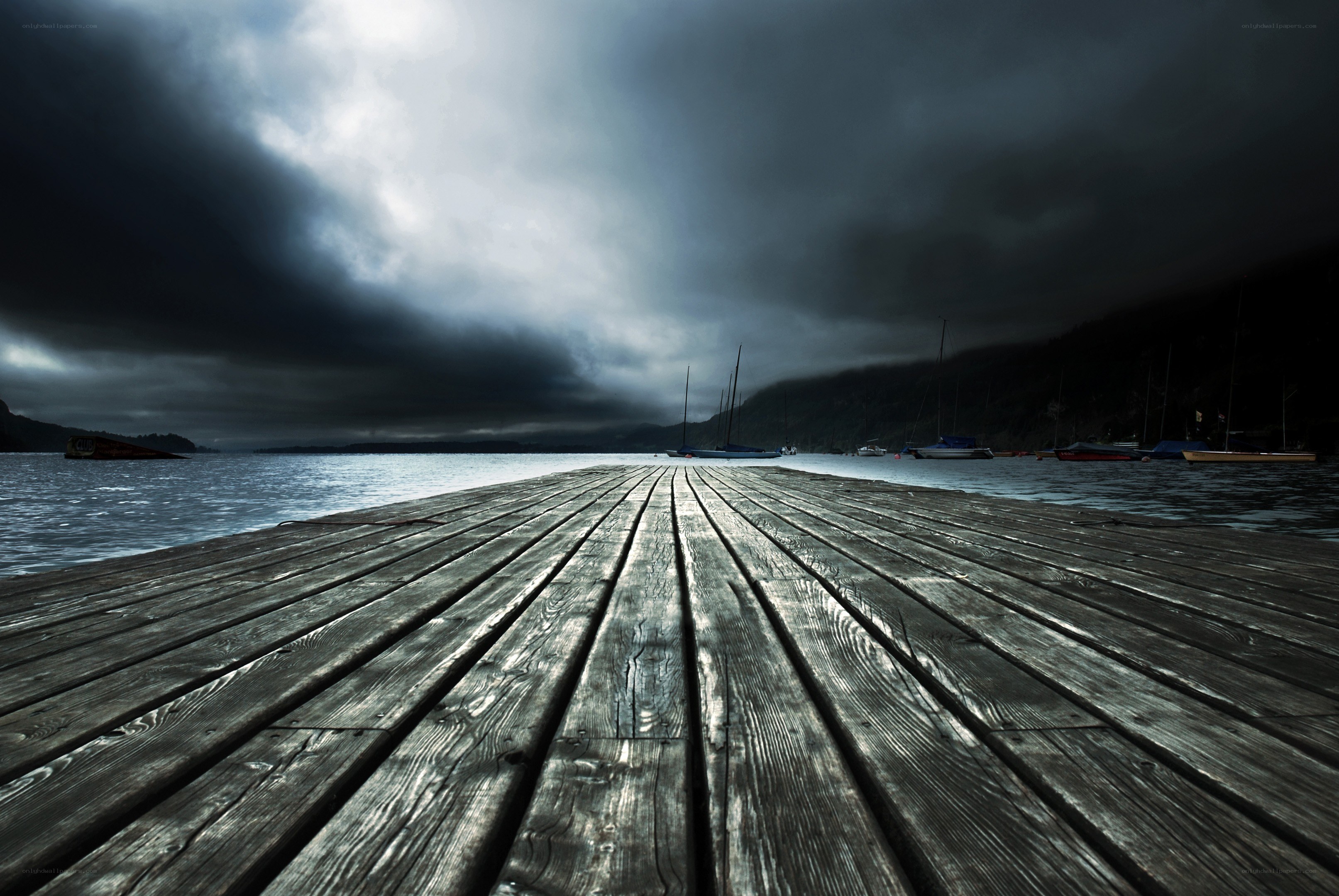 Dark dock under stormy sky