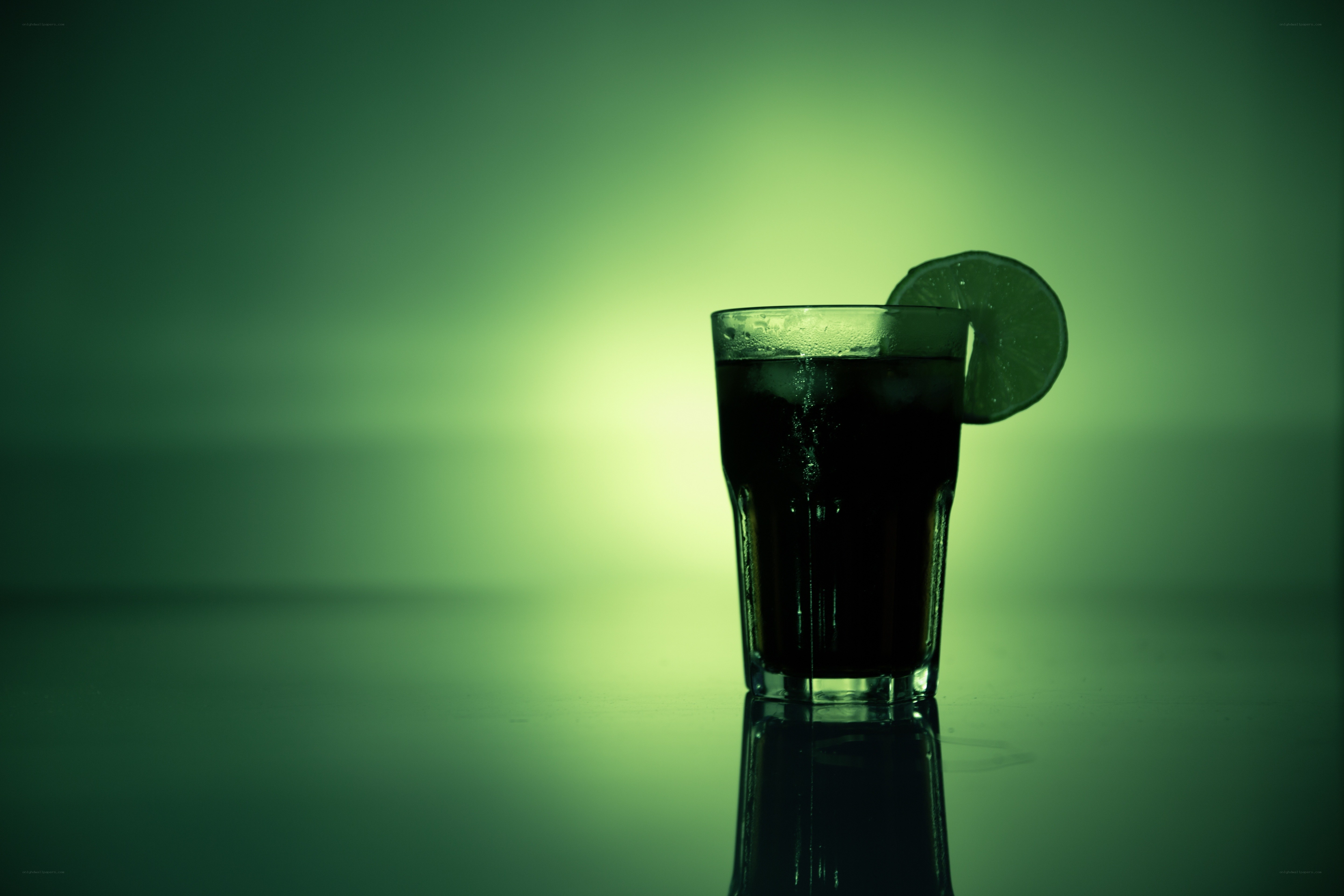dark drink with lime slice