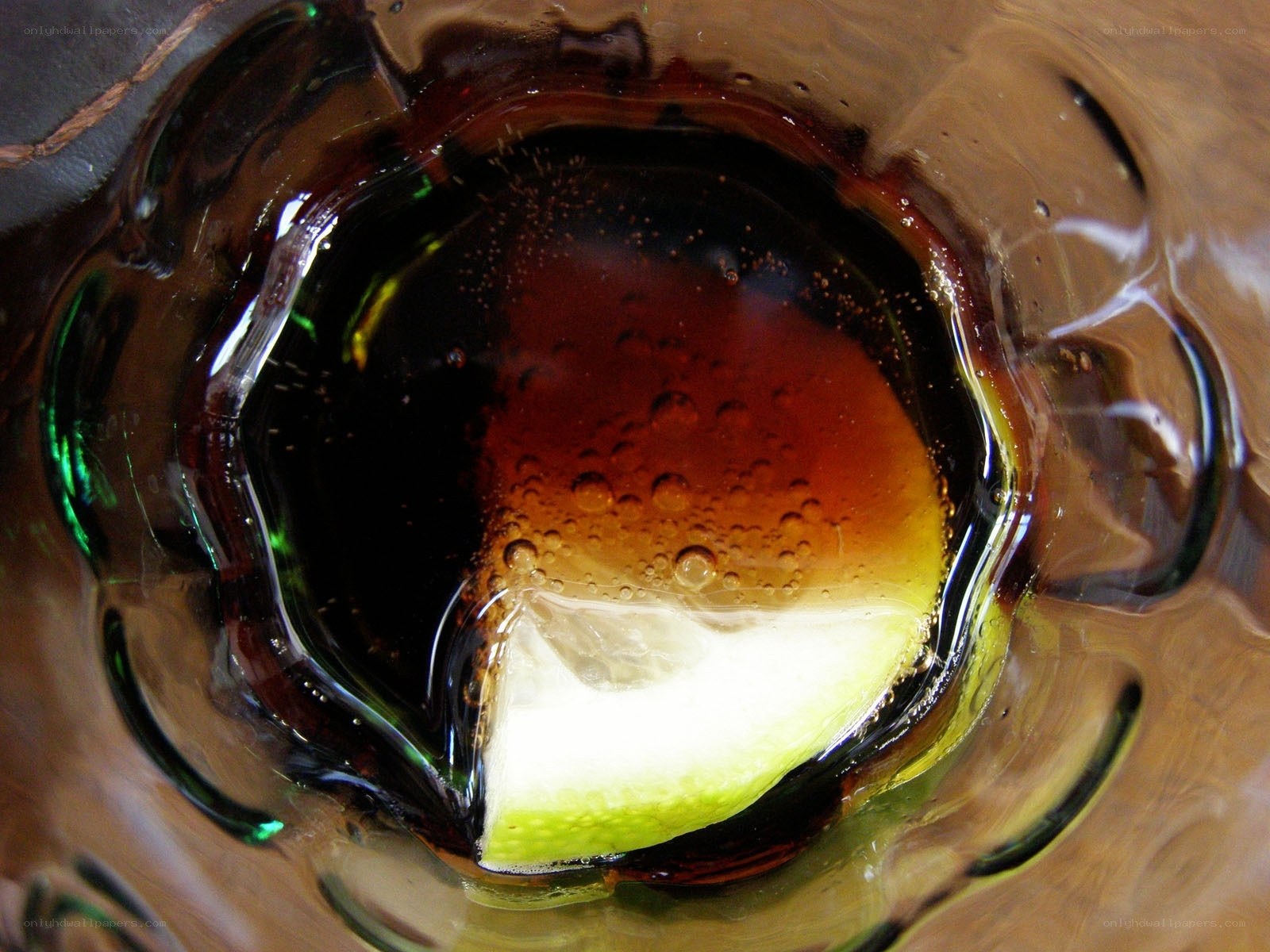 dark drink with lime slice