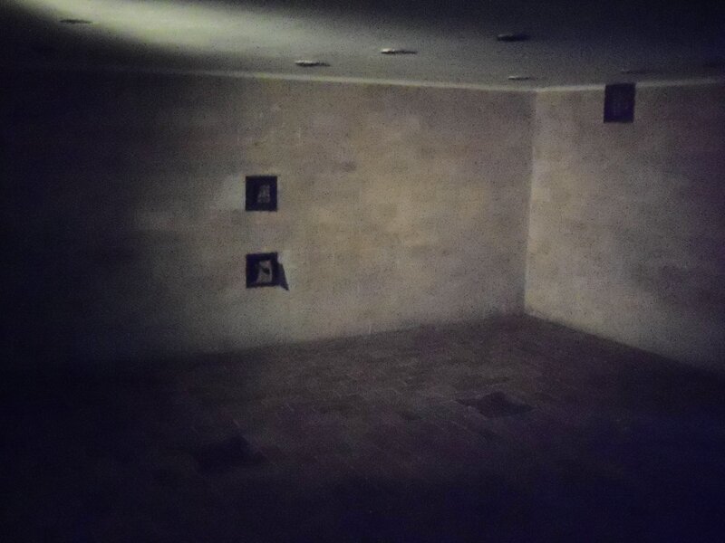 dark empty room with pictures