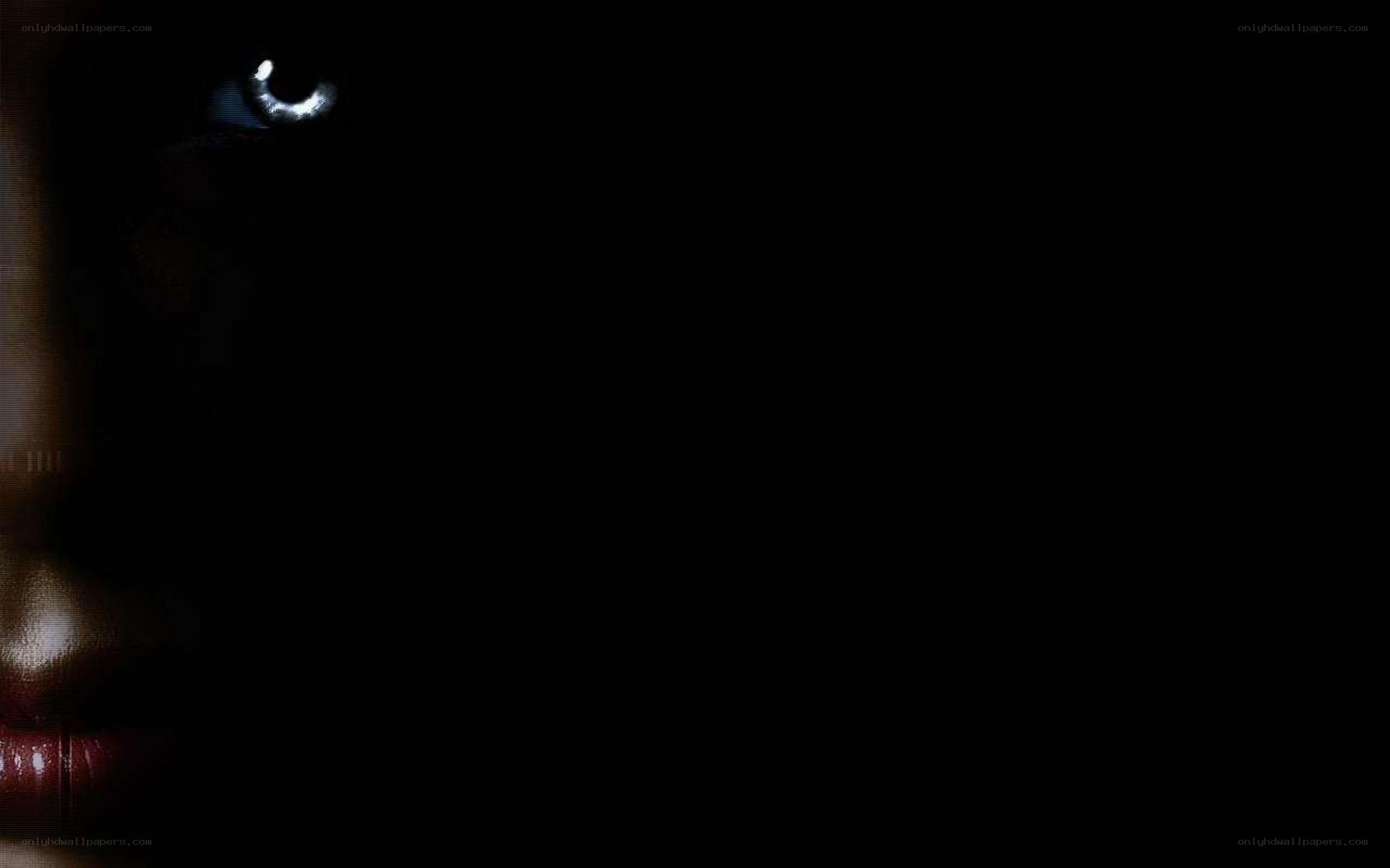 dark face with glowing eye