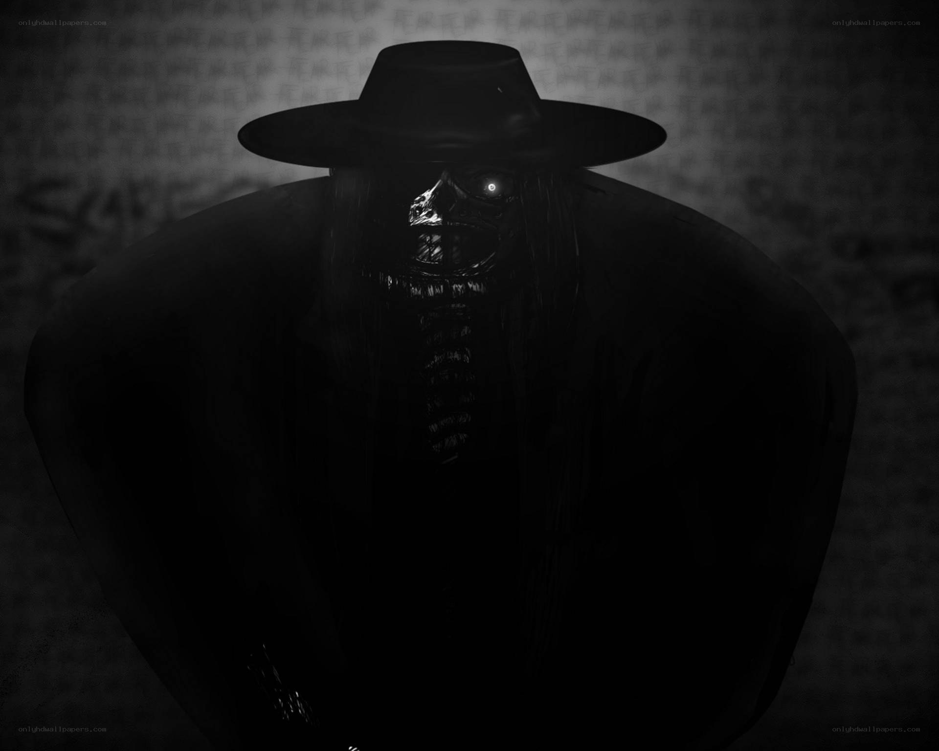 dark figure in a hat