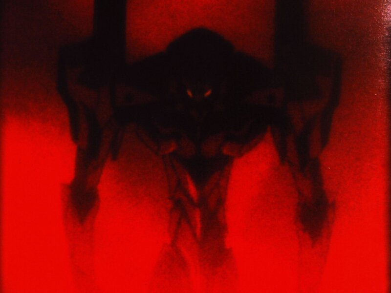 dark figure in red light