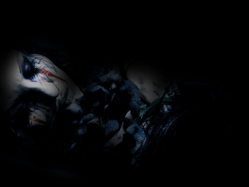 dark figure with dramatic makeup