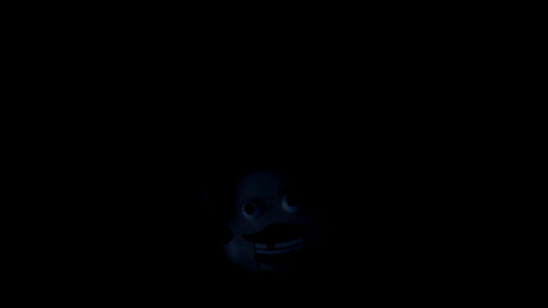dark figure with glowing face