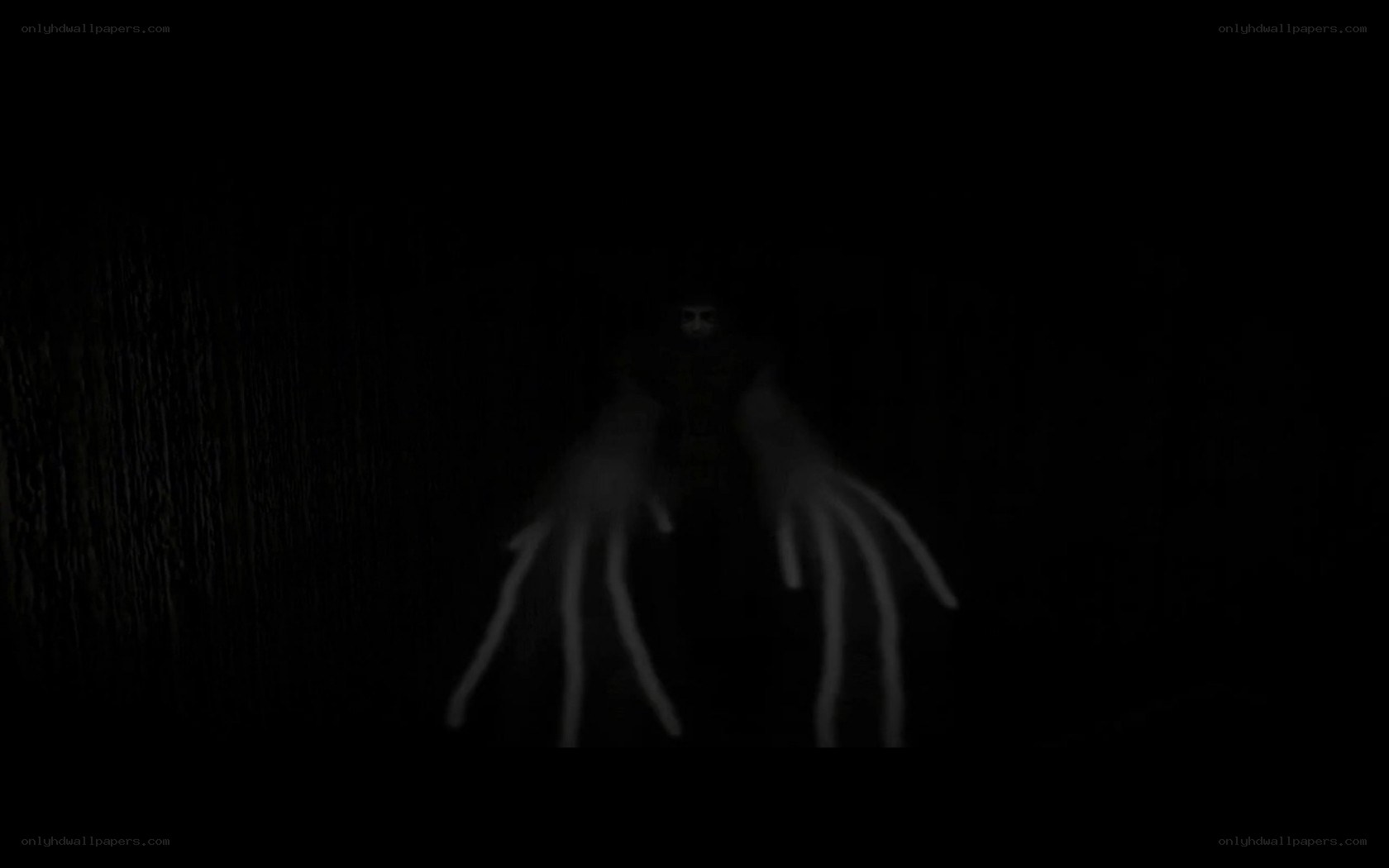 dark figure with glowing hands