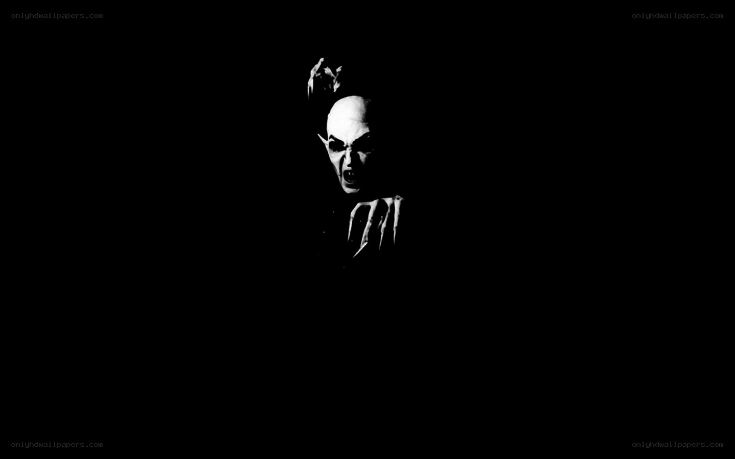 dark figure with sharp teeth