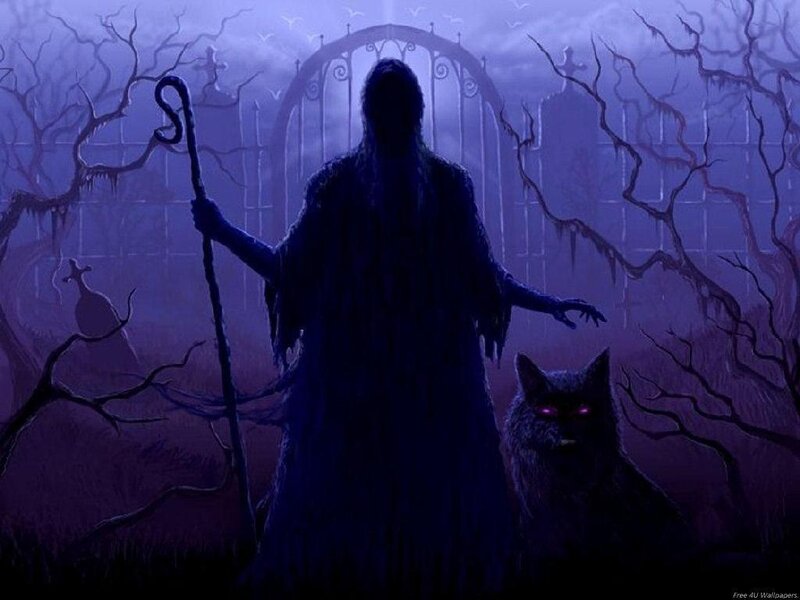 dark figure with staff in graveyard
