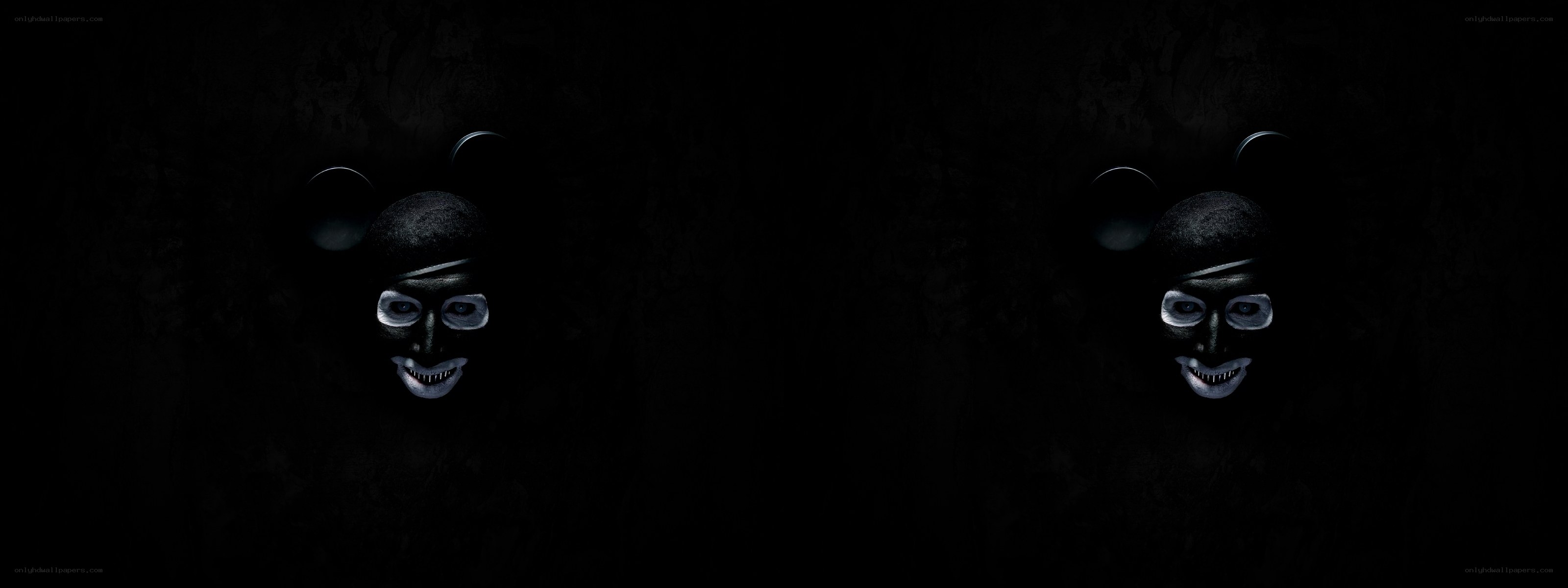 dark figures with mouse ears