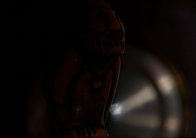 dark figurine in shadow