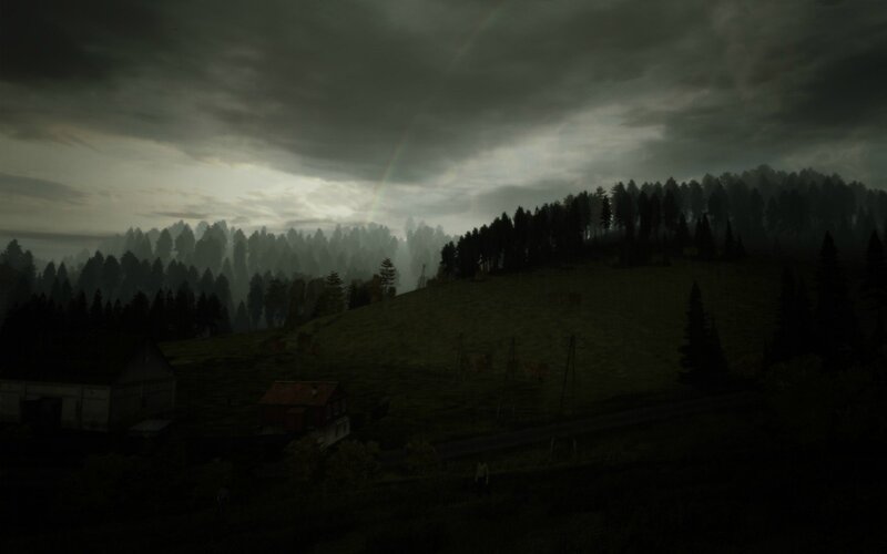 Dark forest landscape with rainbow