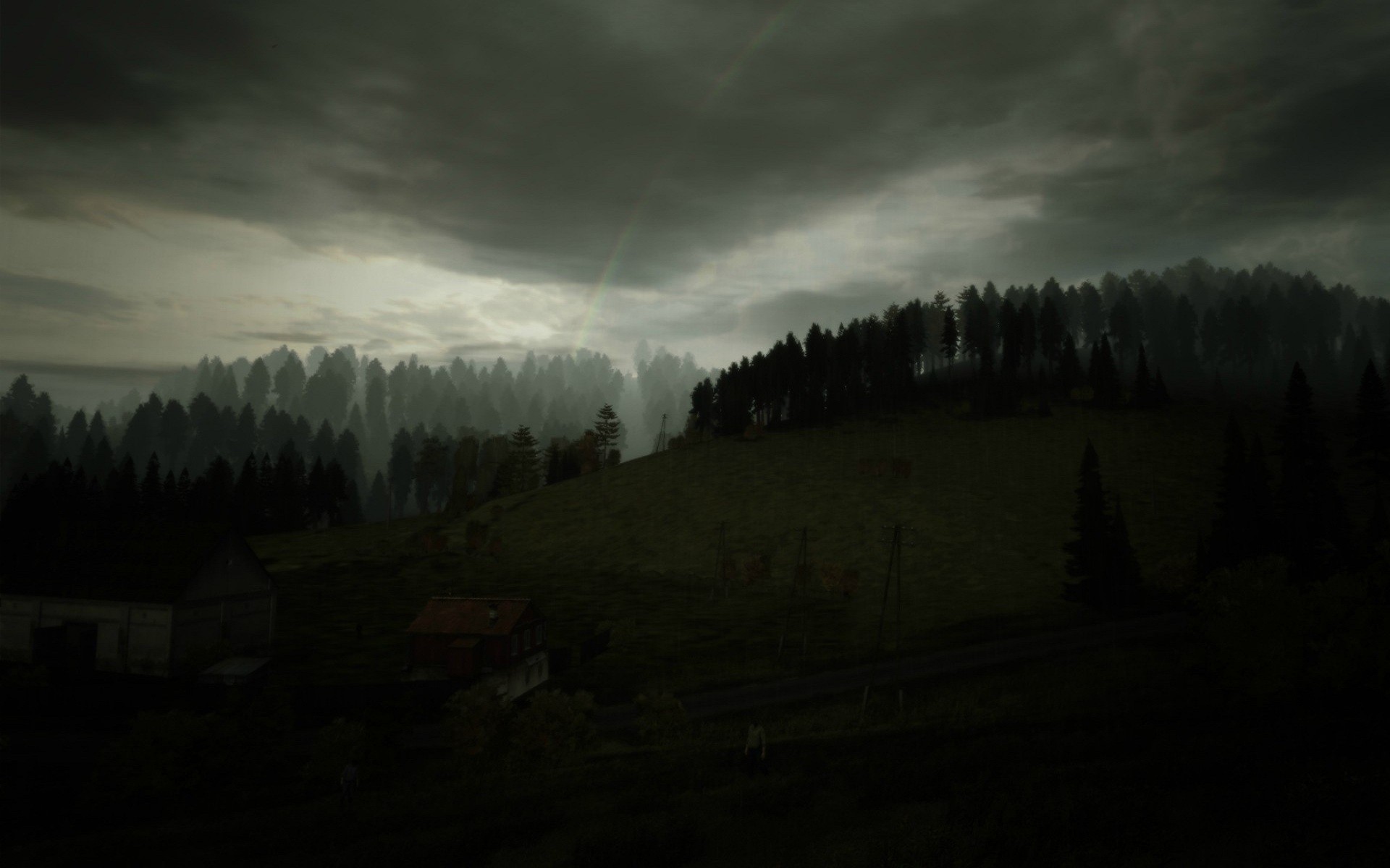 Dark forest landscape with rainbow