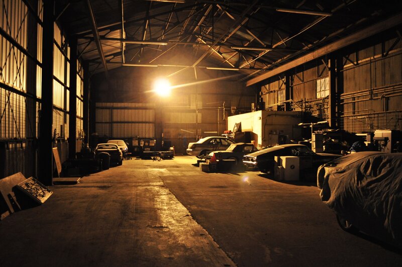 Dark garage with vintage cars