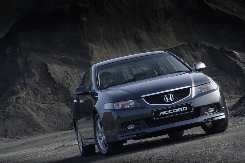 Dark gray Honda Accord on a rocky road