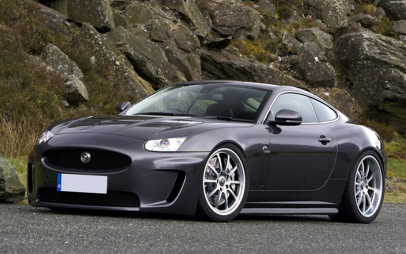 Dark gray Jaguar coupe on road