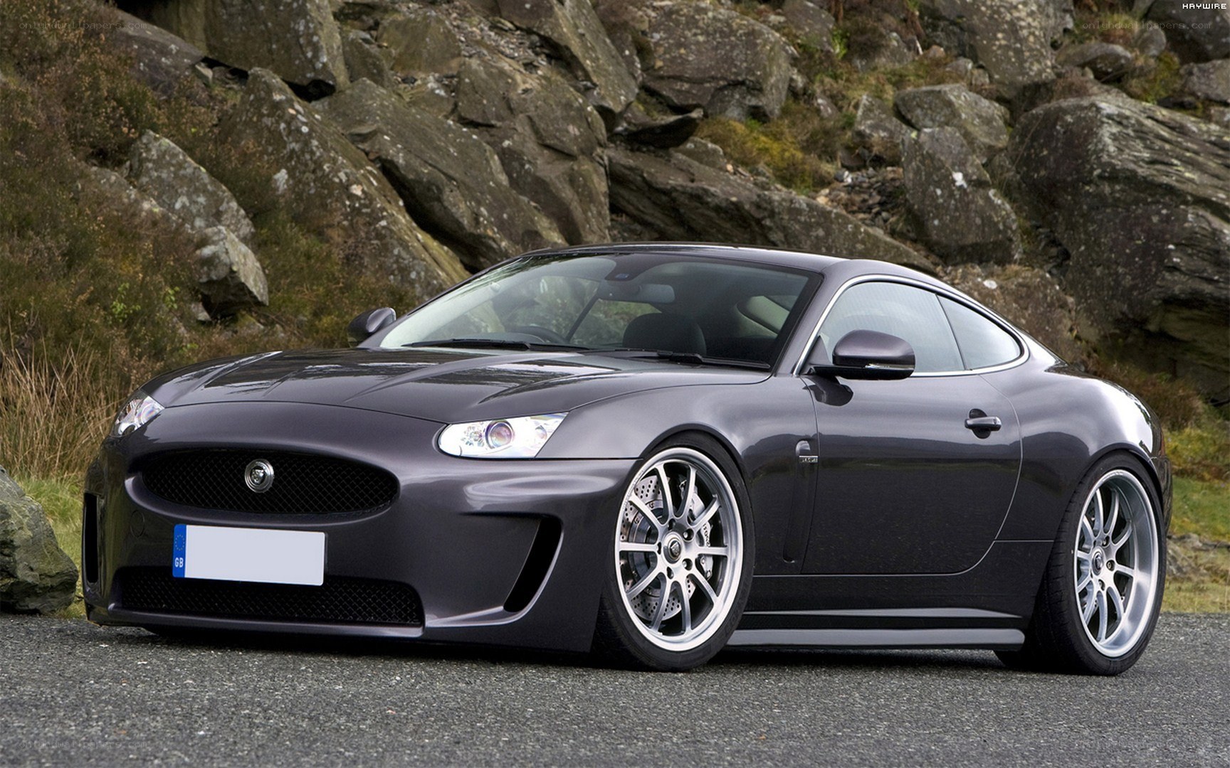 Dark gray Jaguar coupe on road