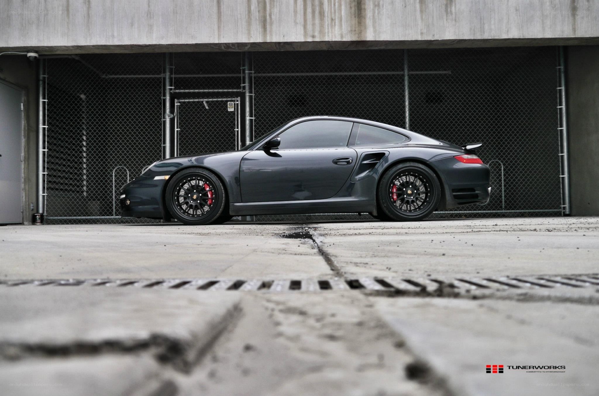 dark gray porsche in garage