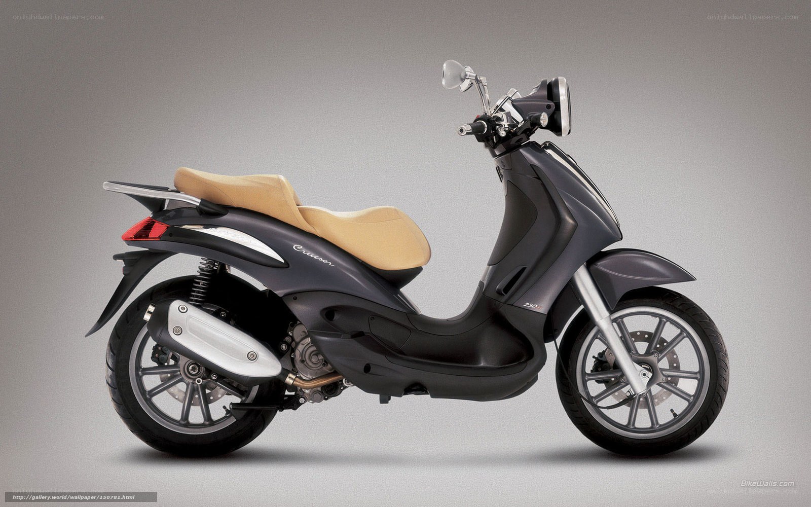 Dark gray scooter with tan seat