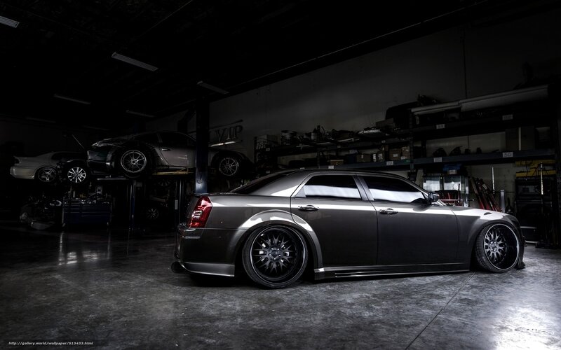 Dark gray sedan in garage