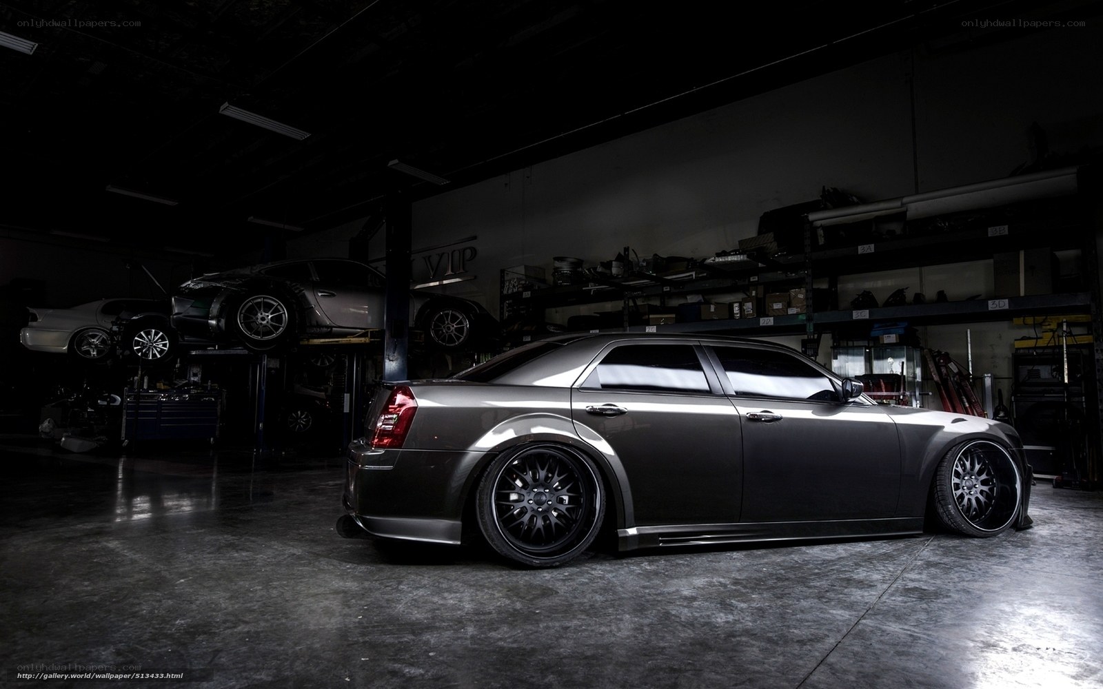 Dark gray sedan in garage