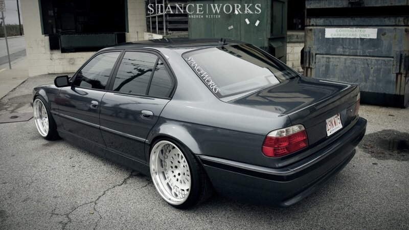 dark gray sedan with custom wheels