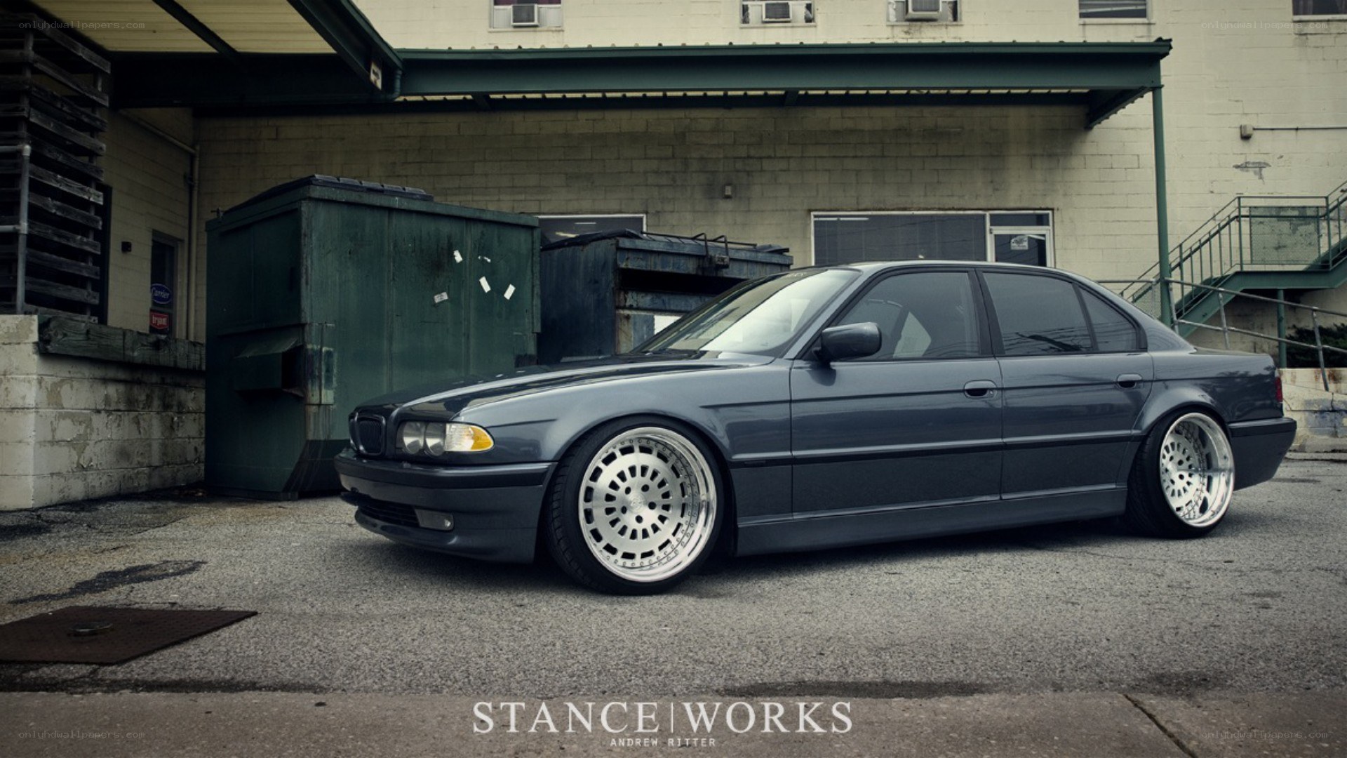 dark gray sedan with custom wheels