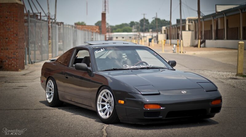 Dark Gray Sports Car — Calm, Afternoon, Photograph, Building