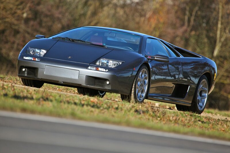 dark gray sports car on roadside