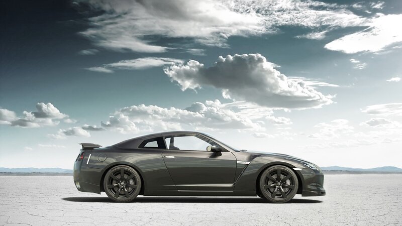 Dark gray sports car on salt flat